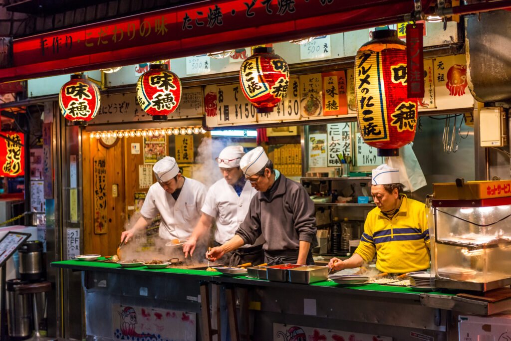 Osaka,,japan, ,december,27:,men,cook,traditional,japanese,street